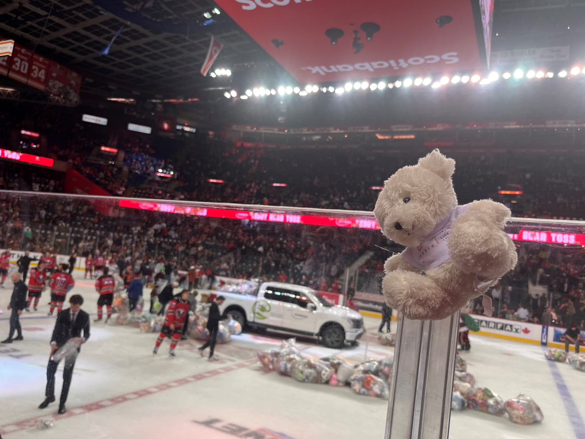 Classic Fire + Life Safety gives out teddy bears to be tossed…onto the ice