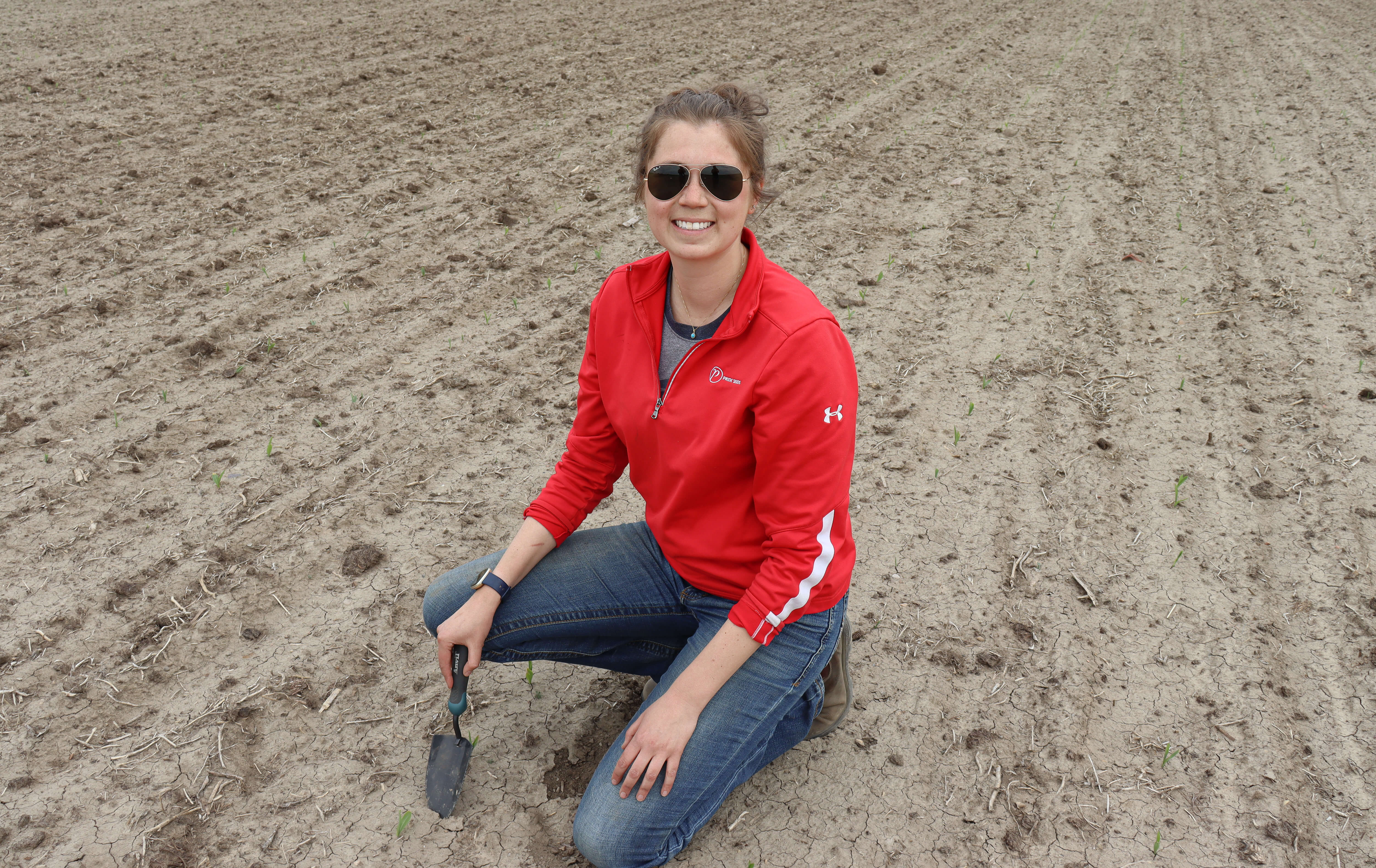 Sara Meidlinger inspecting a field